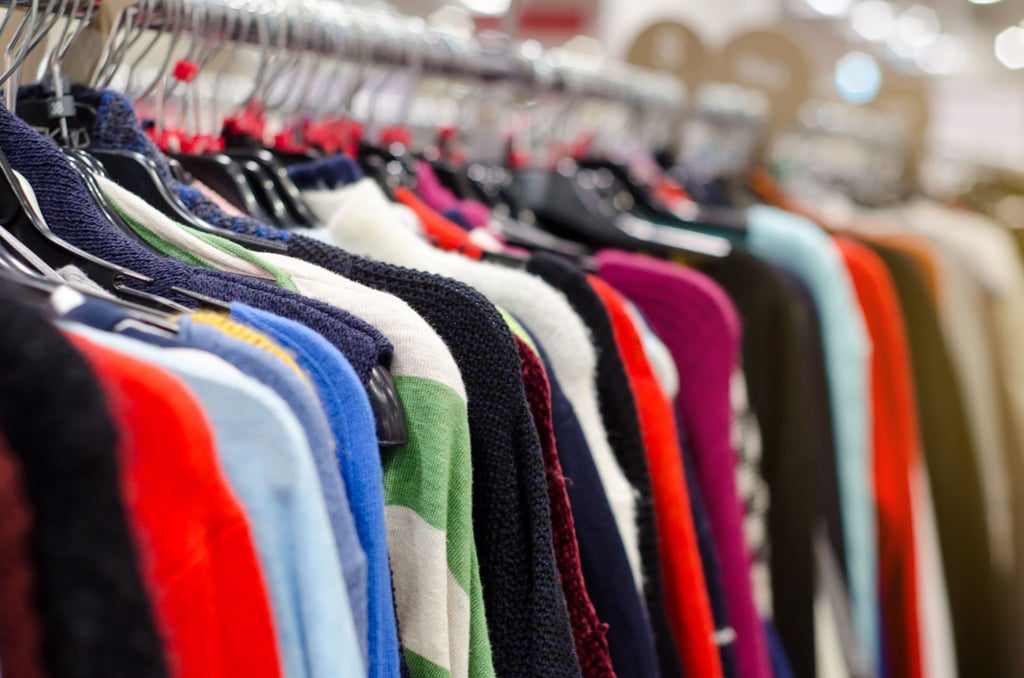 A rack of second hand clothes at a store in Australia.