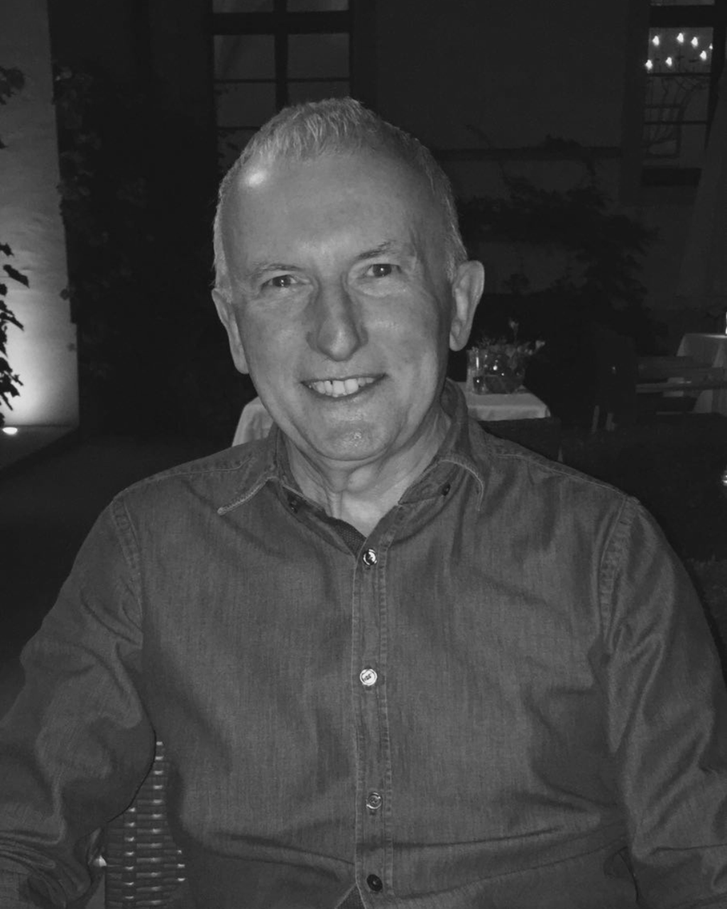 Image of Greg Curry smiling at camera