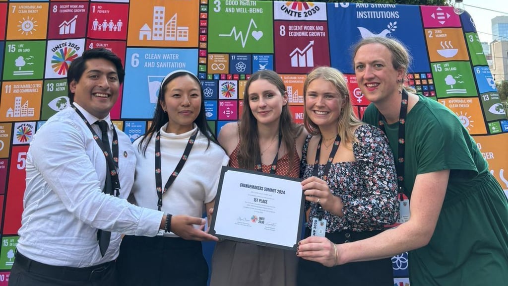 Zara Horton receiving a certificate at the Camp 2030 Summit in New York.