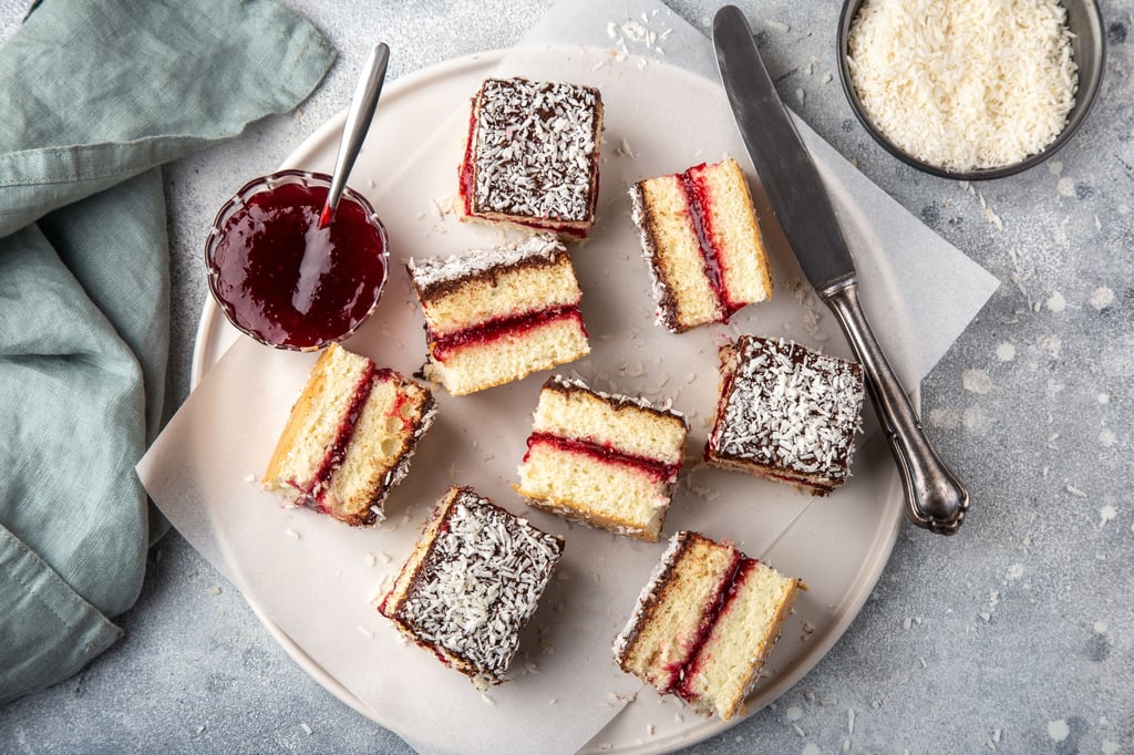 Top down view on jam filled lamingtons, cut into small squares