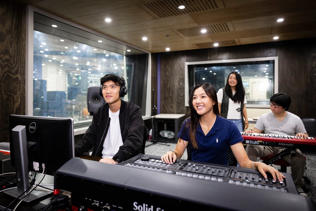 Undergraduate students collaborate on a project in the Building 3 sound studios
