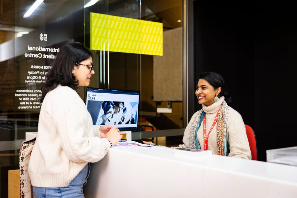 Student talks with student advisor at the UTS International Student Centre.