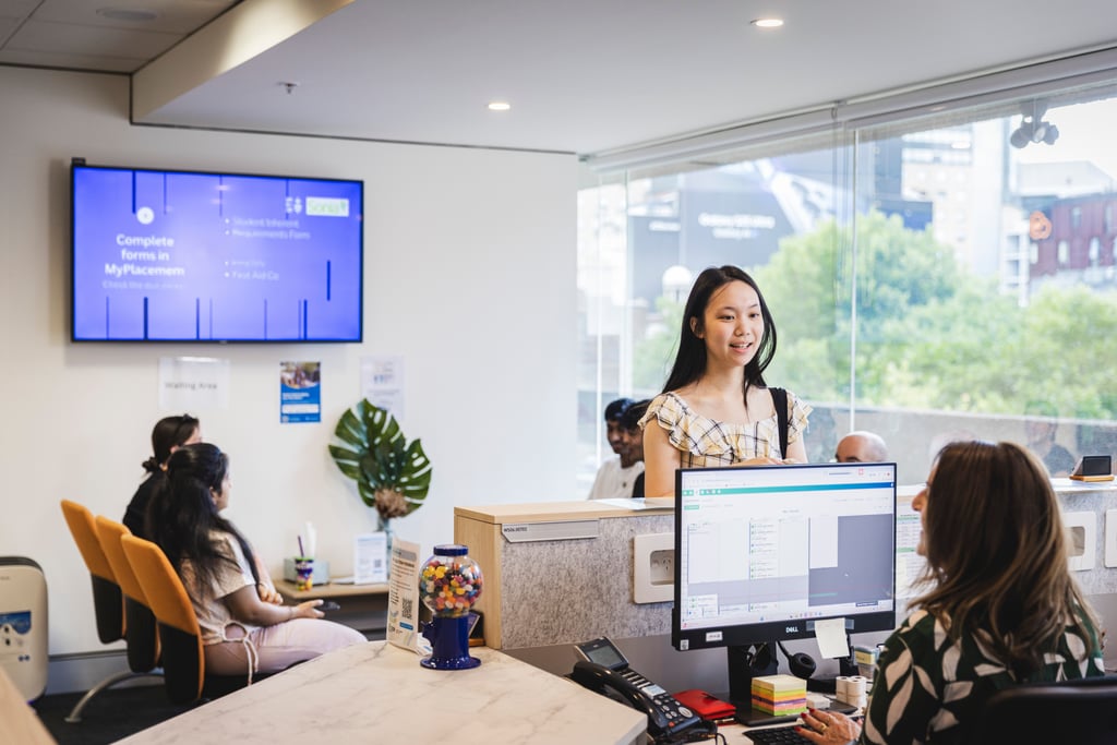 Student at the UTS Health Service talking to receptionist