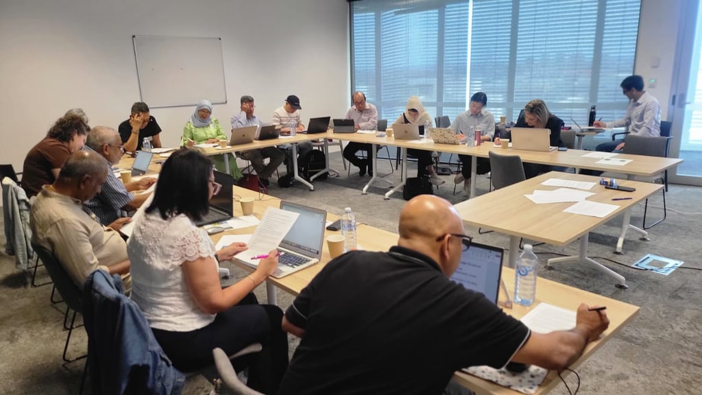 A group of participants in a workshop relating to refugees and the use of AI