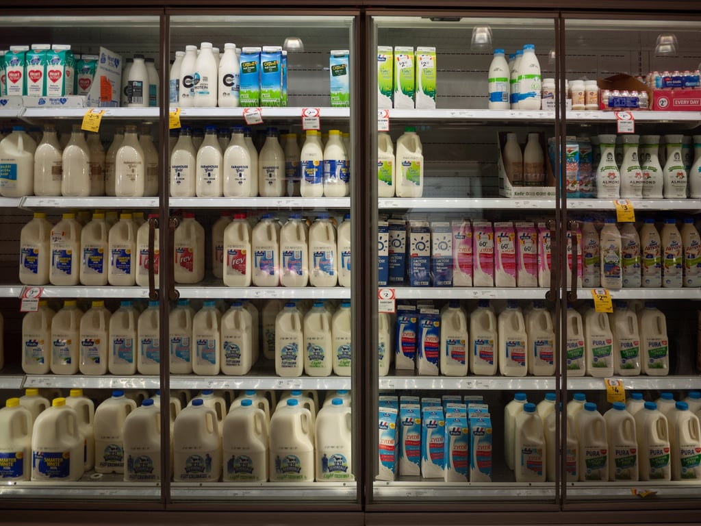Milk of different brands and dairy products are priced for sale in a fridge cabinet in an Australian supermarket for customers to choose from. Picture: Doublelee/Adobe Stock