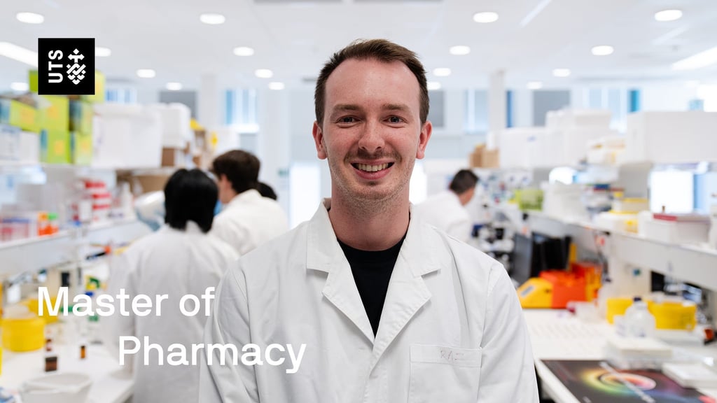 Cooper, a Master of Pharmacy student, standing in a lab at UTS.