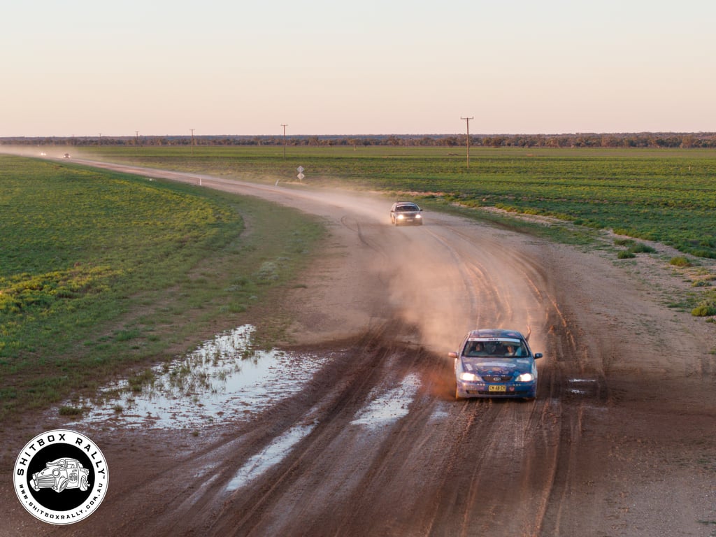 Driving through mud on the dirt road