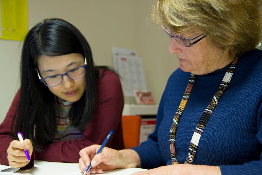 Two people working on a document