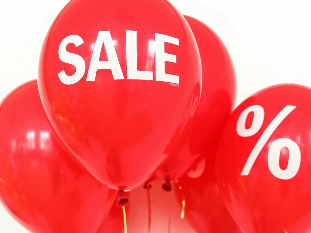 A bunch of red "sale" balloons.  Picture: Polina Tankilevitch/Pexels, CC BY 4.0