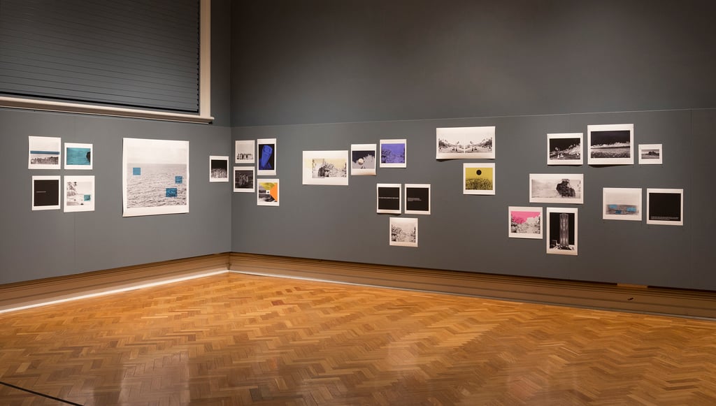 Image shows part of the gallery where the historic photographs of Nauru were exhibited. 26 photos are visible.