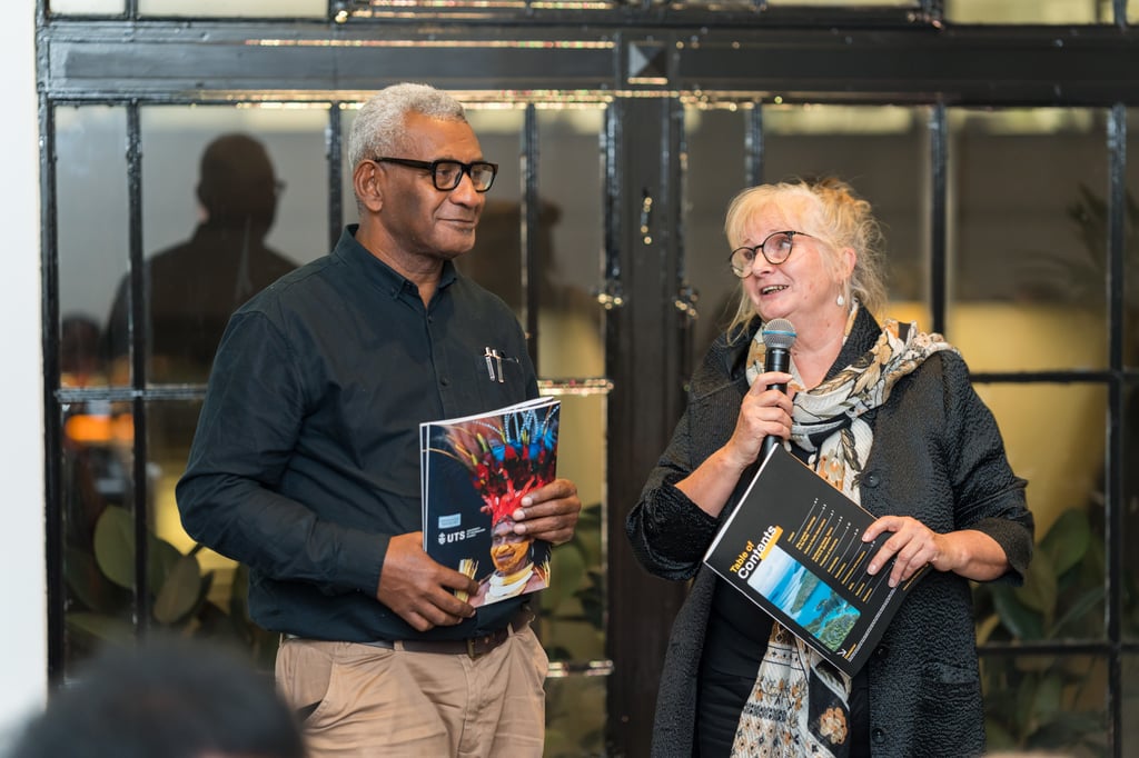 Two people with a microphone launch Principles of Partnership