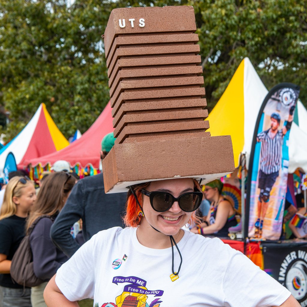 Micah wearing a UTS tower hat at Fair Day