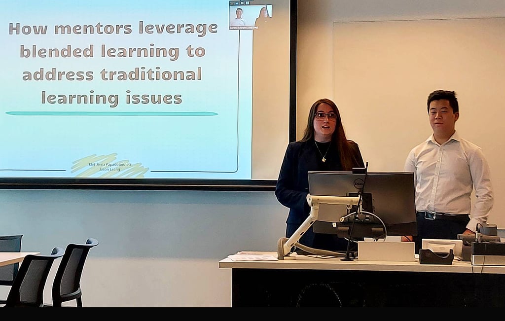 Two people standing behind a lectern, presenting
