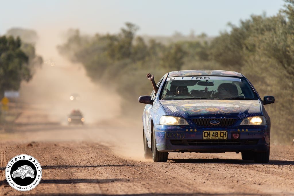 Steffi Dourado driving a car in the Shitbox Rally 2026