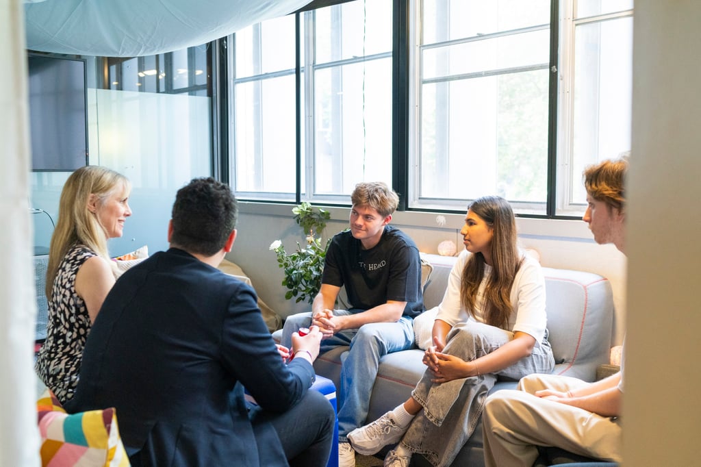 Students discussing ideas at the 2024 Bachelor of Creative Intelligence and Innovation showcase