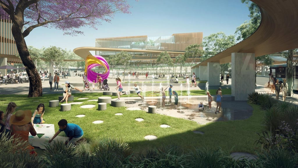 Children play in a modern park with interactive water features. A colorful sculpture and lush trees create a vibrant and lively atmosphere.