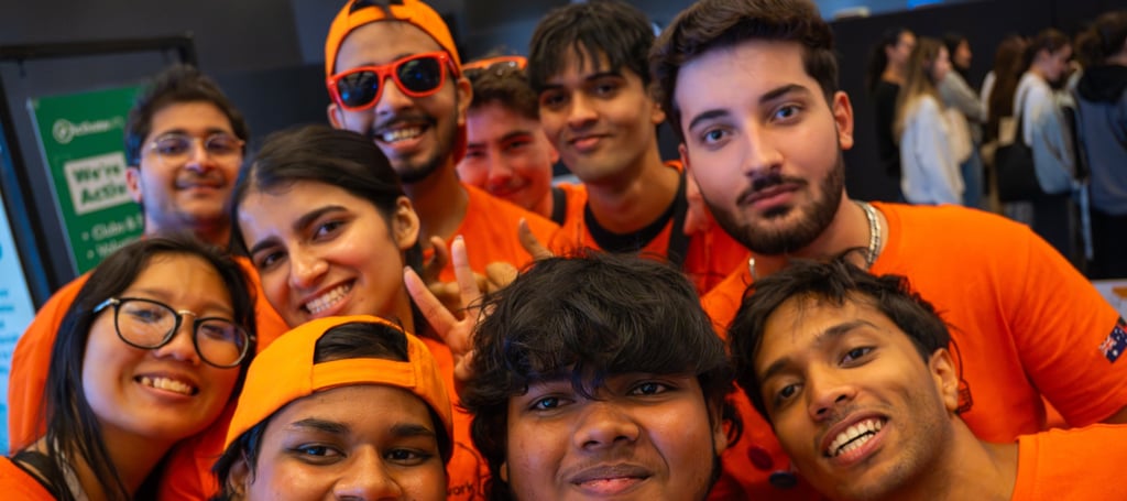 Group of Peer Networkers wearing orange t-shirts.