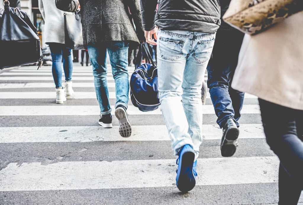 Crowd of people walking on zebra crossing street city centre. Picture: Disobey Art/Adobe Stock