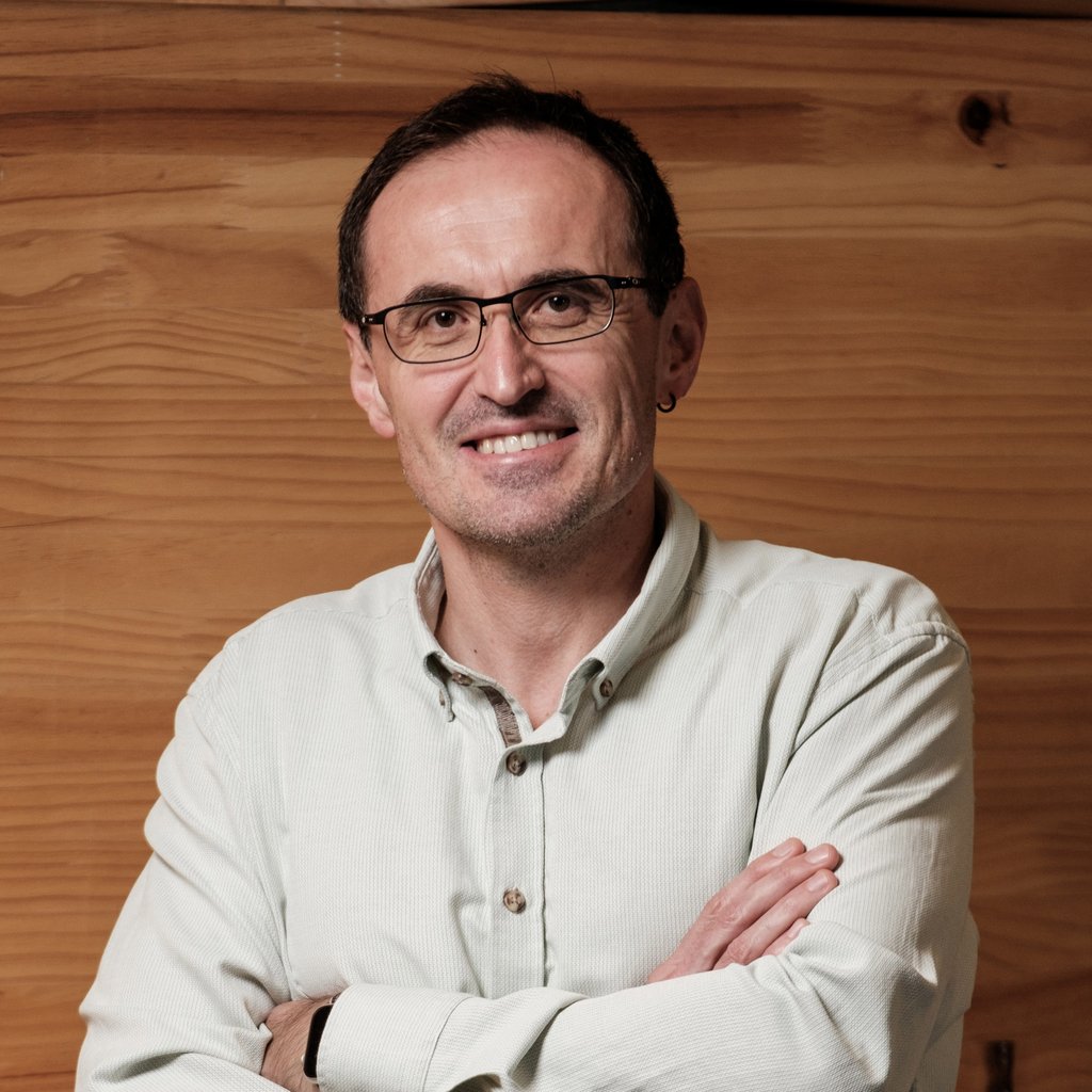 Profile image of Isa Hafalir standing with arms folded