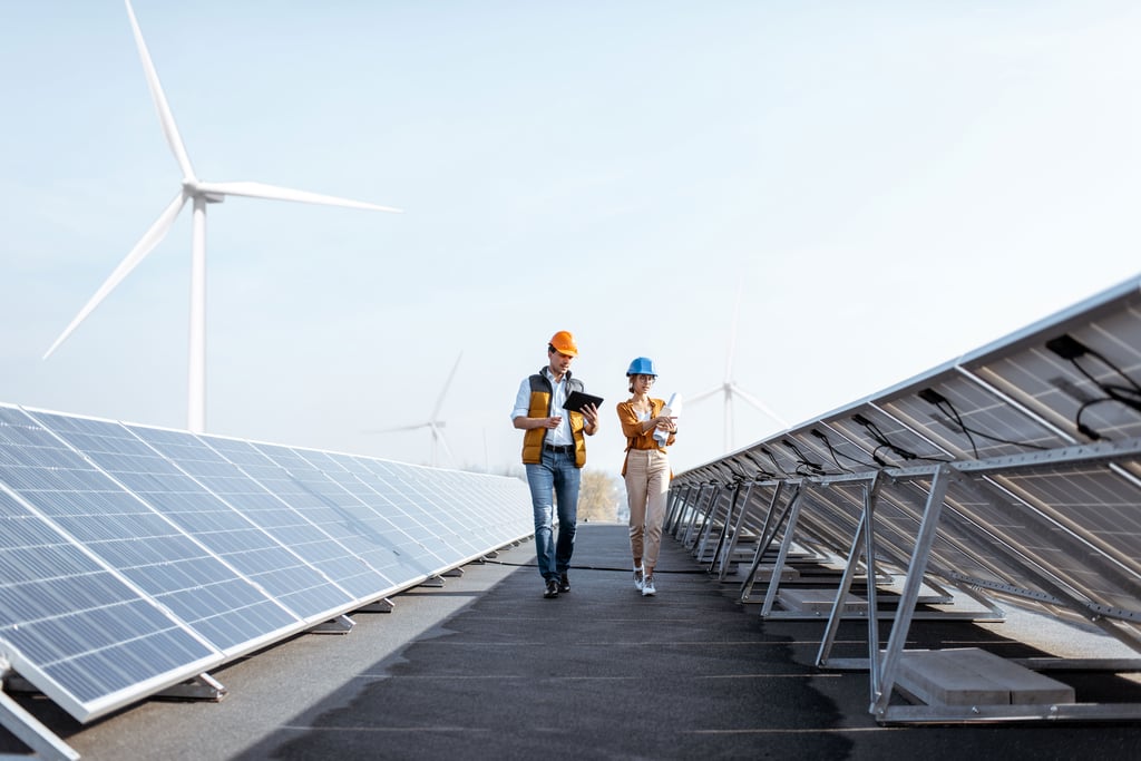 workers on solar and wind turbine site