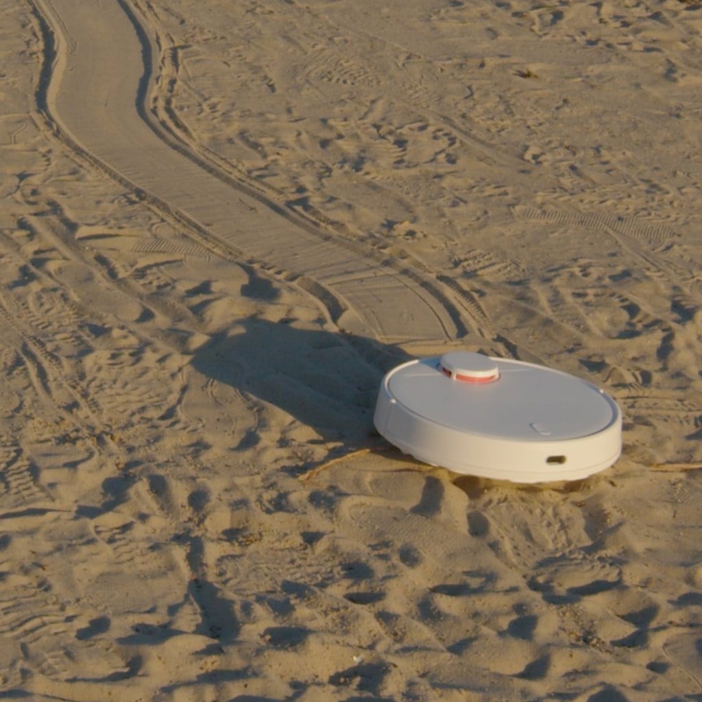 Robot vacuum on sand
