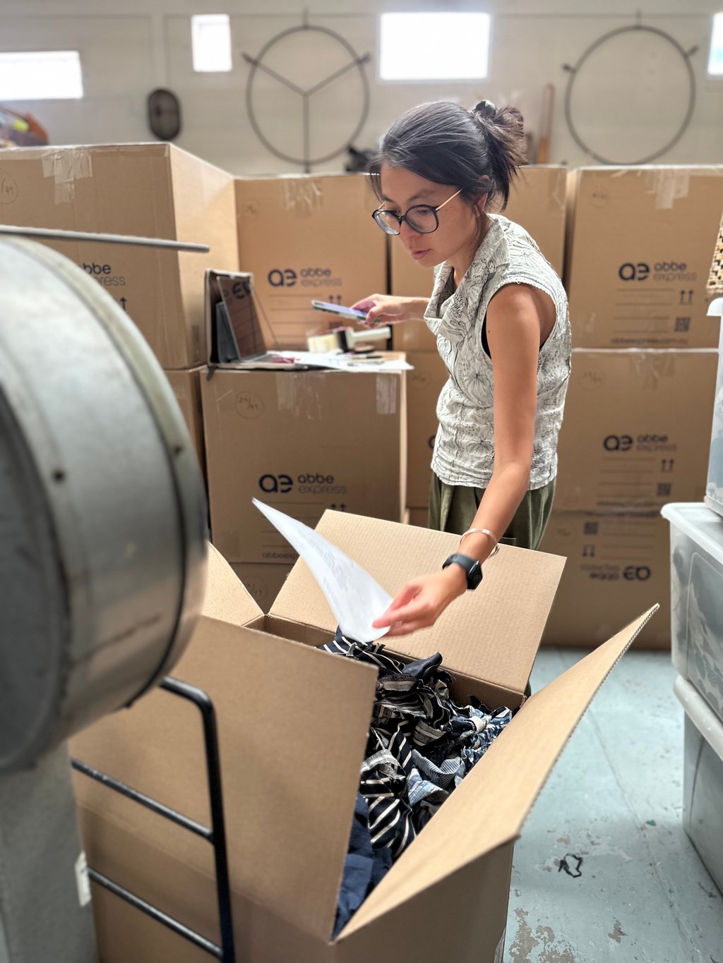Angela Foong sorting fabric cuttings