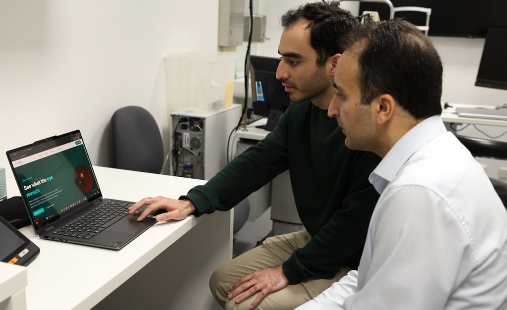 Photo of MJ Golzan and another using the AI tool
