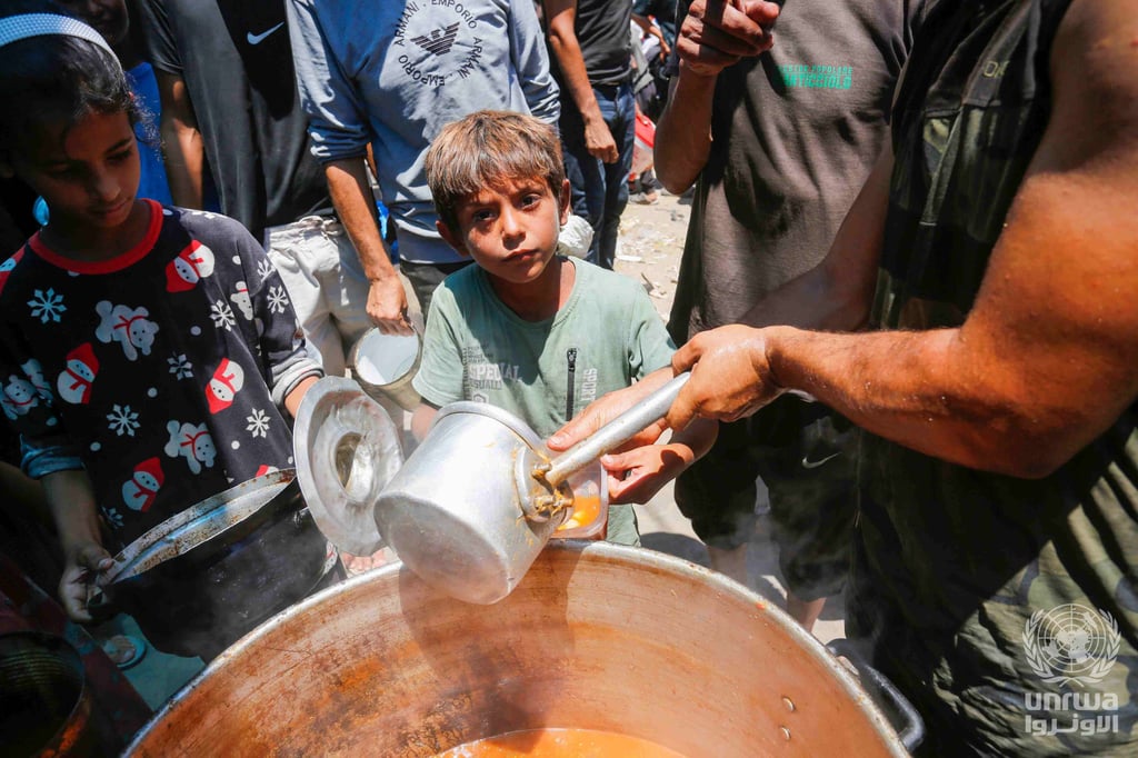 Displaced Palestinians gather to receive food from a charity in Deir el-Balah, Gaza Strip
Date	26 June 2024
Source	UNRWA: United Nations Relief and Works Agency for Palestine Refugees in the Near East
Author	Ashraf Amra