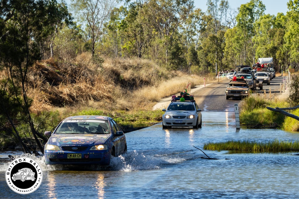 Shitbox Rally cars driving through water