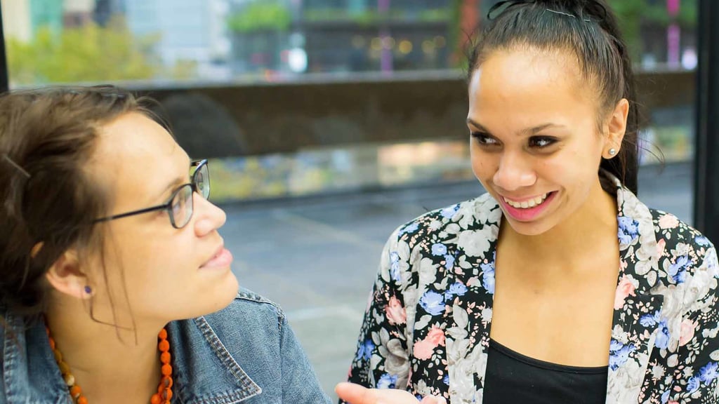 Two University of Technology Sydney students smiling and talking