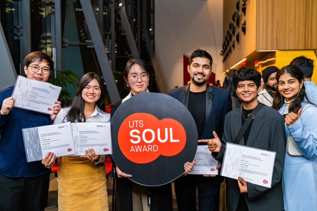 Shiva Sharma standing with fellow students holding a sign that says "UTS Soul Award"