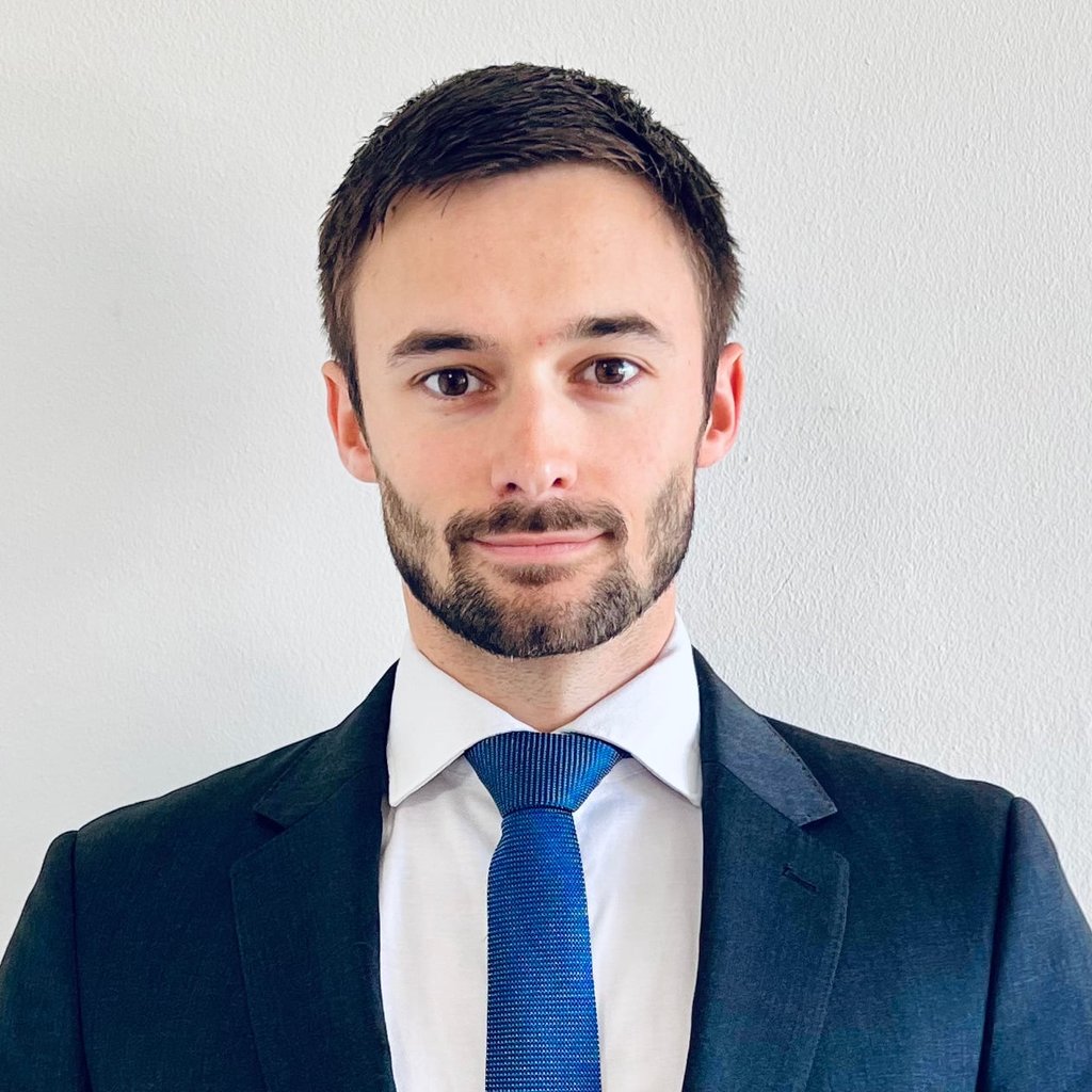 Image of young male with a beard in a blue suit - Quentin Dequiret