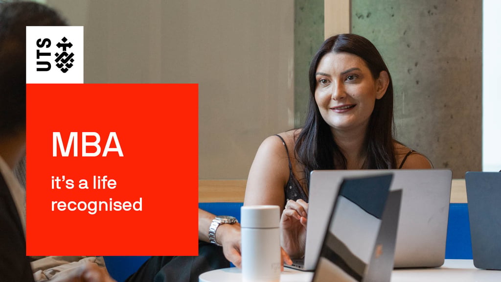 The words "MBA, it's a life recognised" are contained within red block graphic with the UTS logo. Alison Gibson sits with a laptop in front of her within the UTS Business School. She's smiling at another student offscreen.