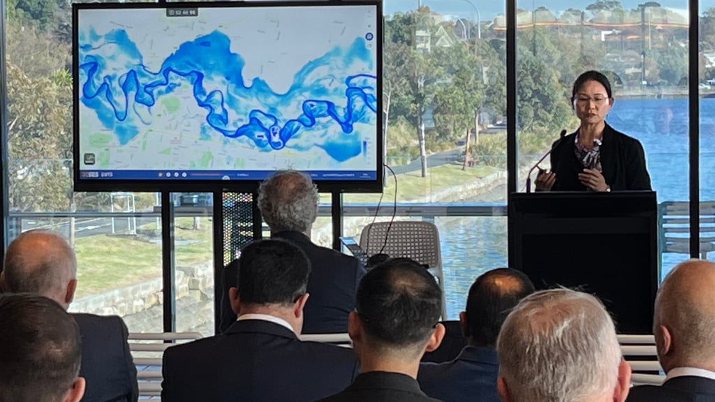 Associate Professor Wenjing Jia demonstrates the flood digital twin.