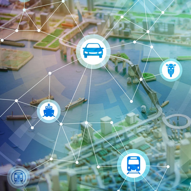 Transport icons overlaid on a digital illustration of a city.