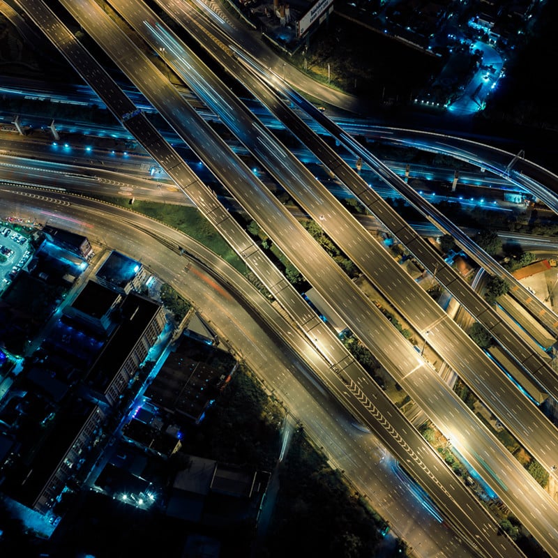 Aerial view of roads and highways at night.