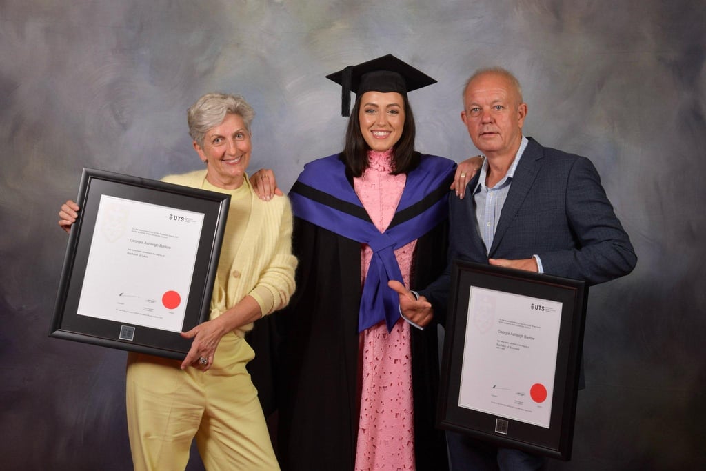 Georgia celebrates her graduation with her parents