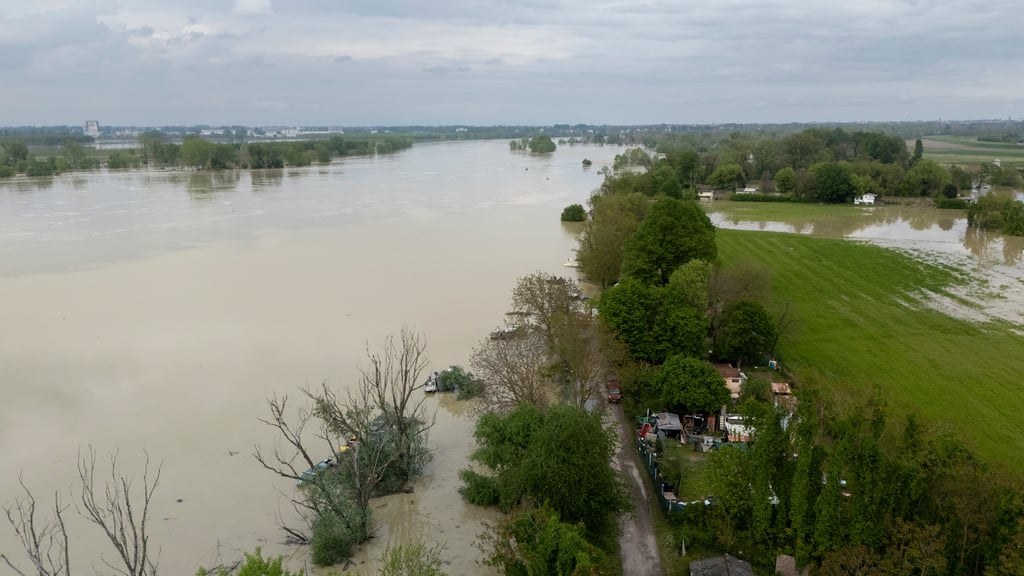 Flooding muddy waters overwhelming rural landscape