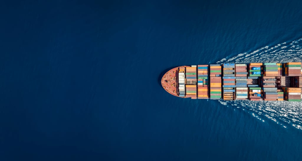 Aerial Top down View of a Large Container Cargo Ship in Motion