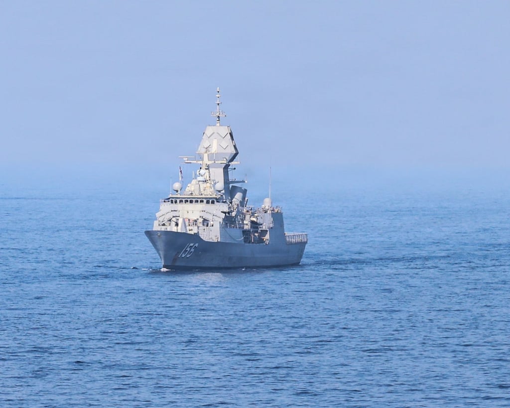 HMAS Toowoomba (FFH 156) cruises in formation with ships during the group sail exercise for Exercise Balikatan 2026
