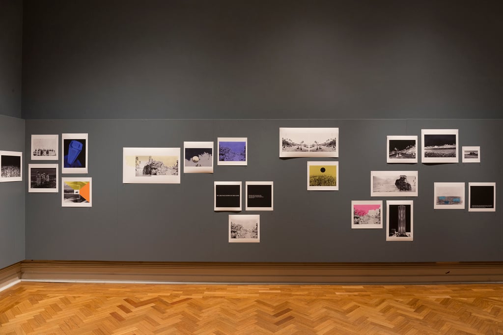 Image shows part of the gallery where the historic photographs of Nauru were exhibited. 21 photos are visible.