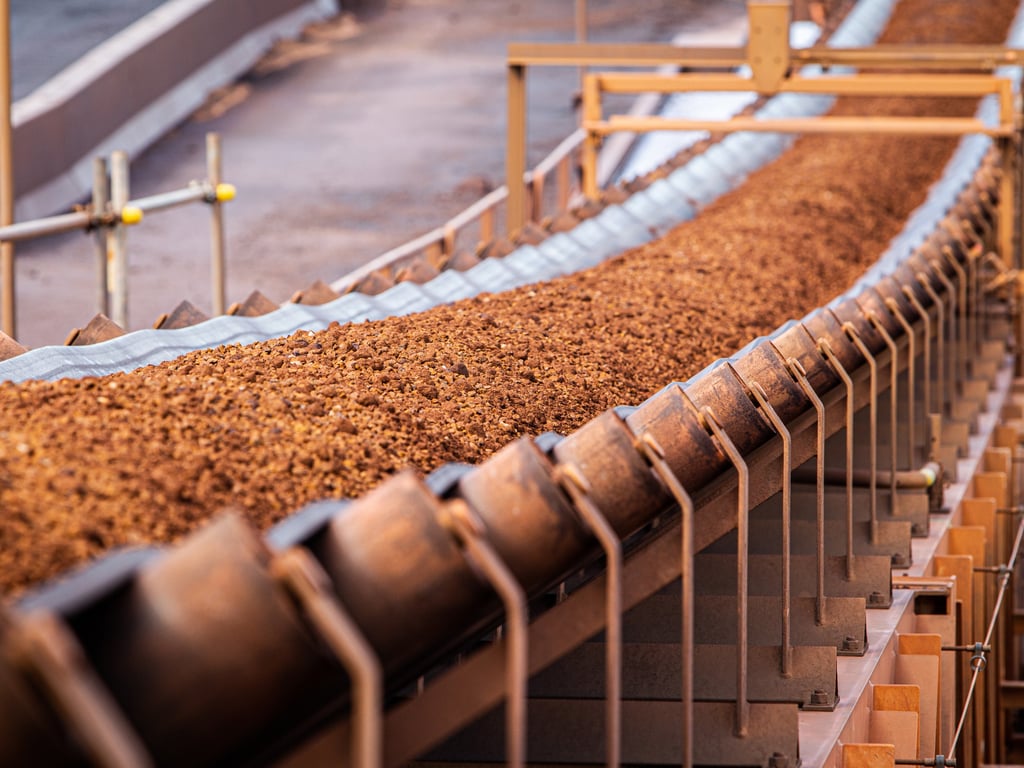 Conveyor belt moving iron ore. Picture: John/Adobe Stock