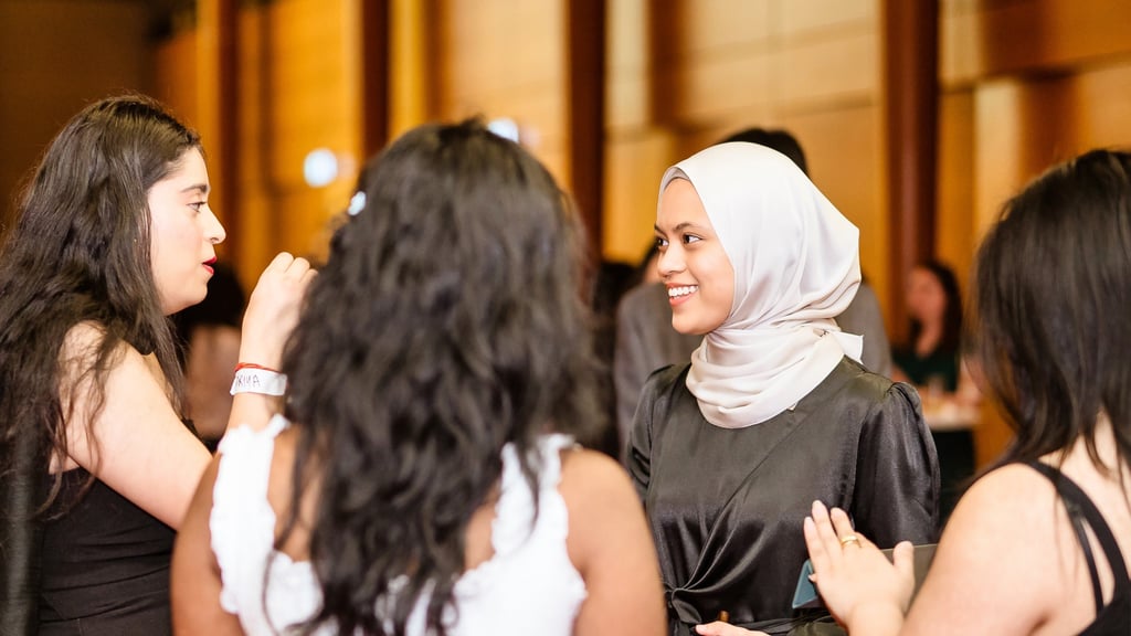 Women in conversation at an event