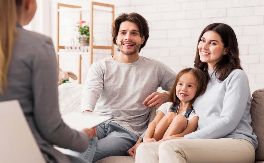 Smiling young family at a therapy session.