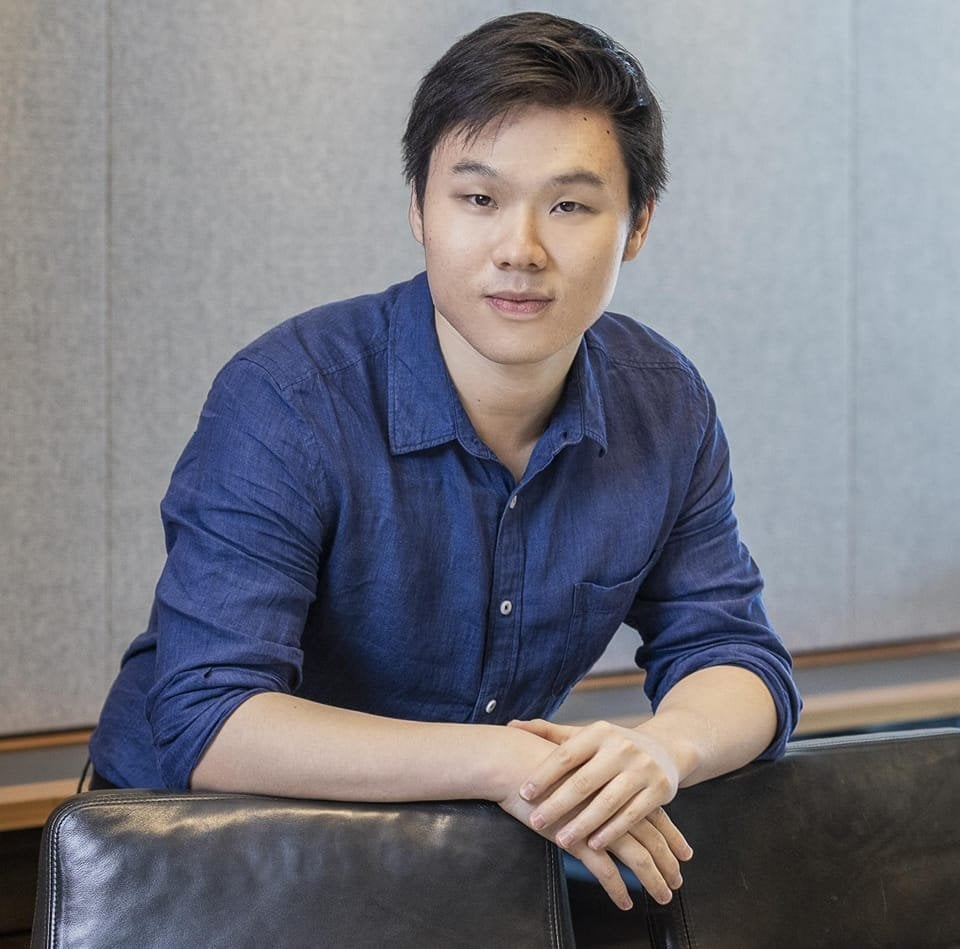 Image of Ray Sun smiling at the camera