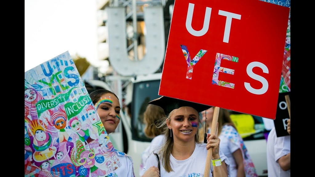 UTS students holding banners reading UT-yes