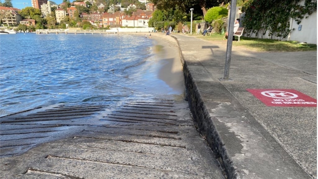 A concrete walkway beside the harbour.