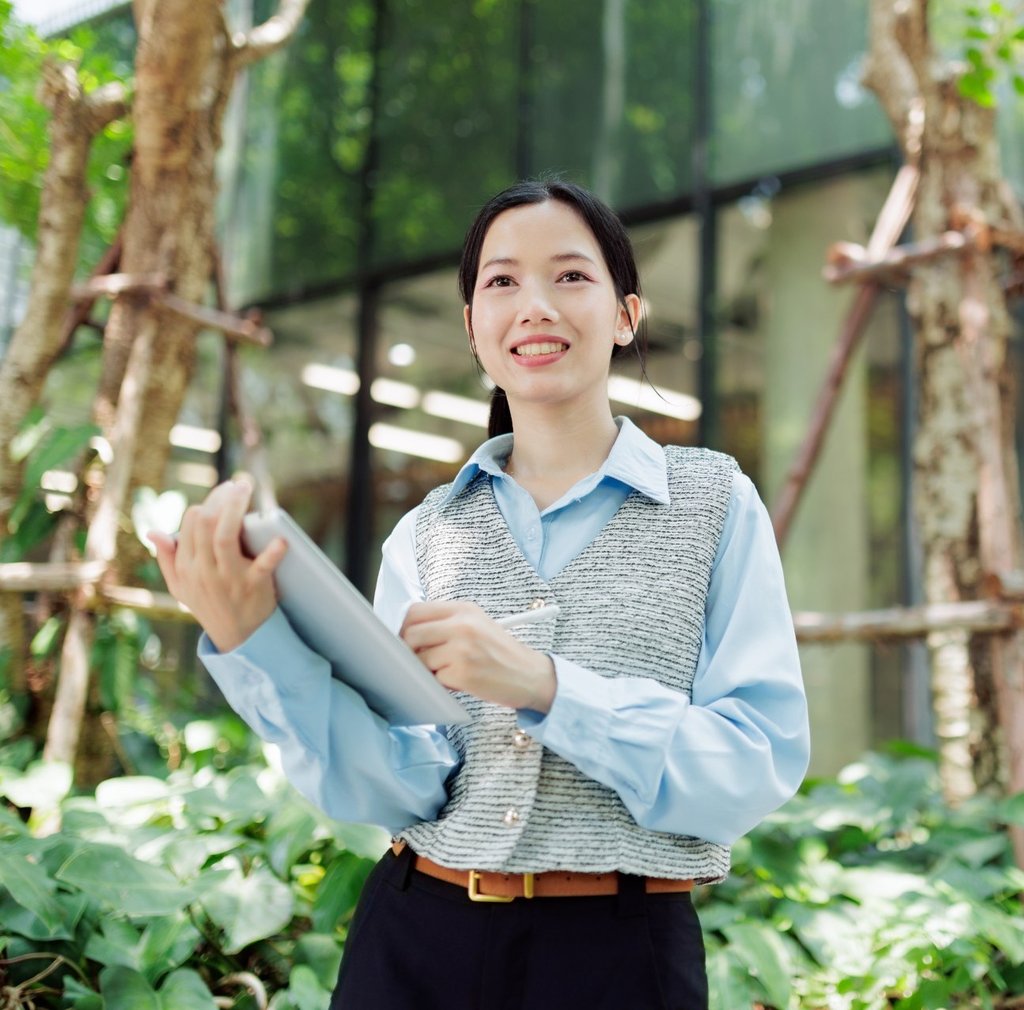 Woman standing in green space