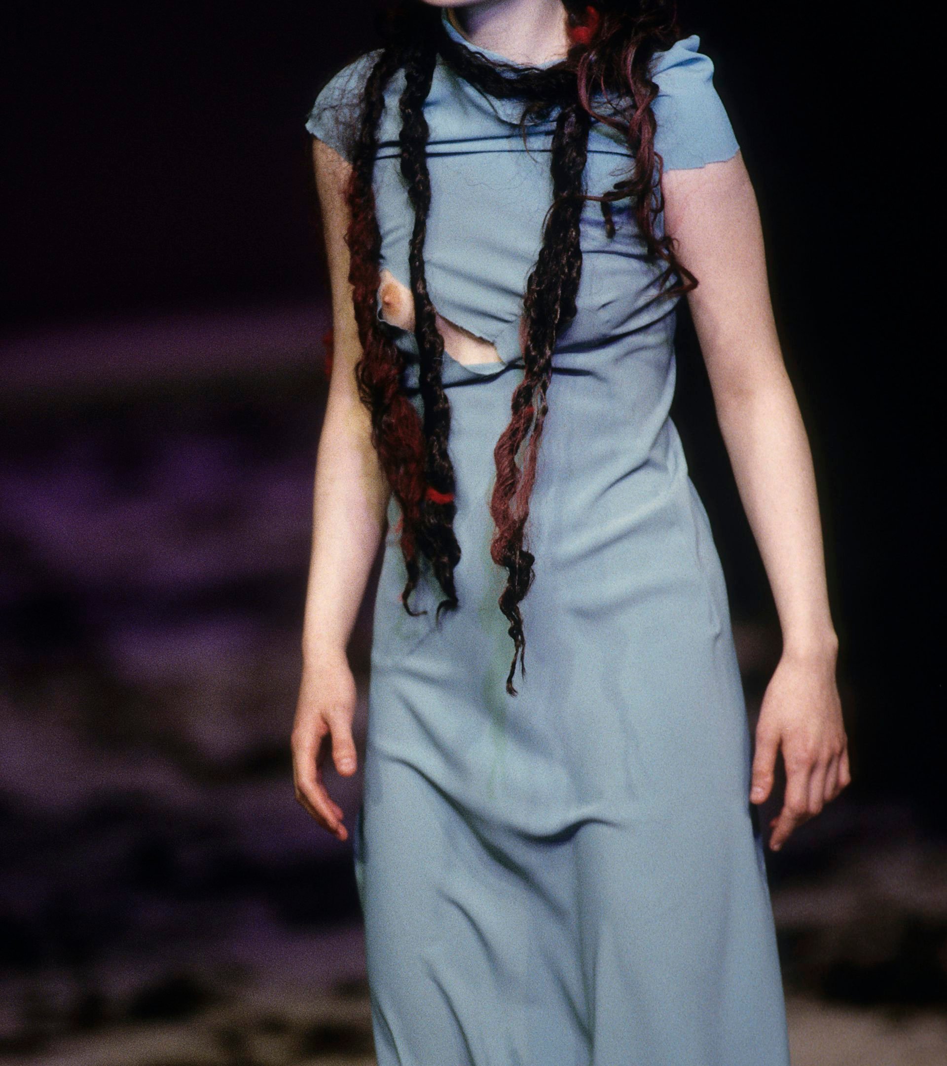 Woman in a ripped blue dress