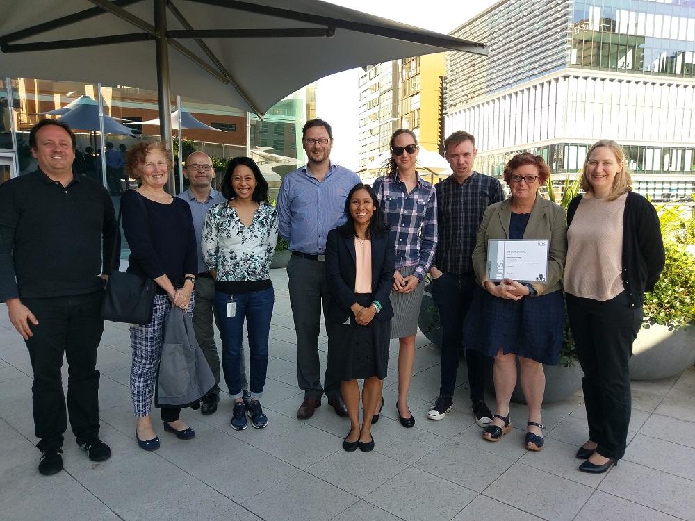 Rosalie Viney celebrating her award with members of the CHERE team